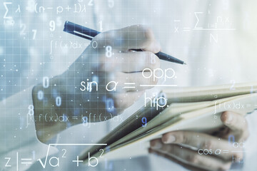 Double exposure of creative scientific formula concept with man hand writing in notebook on background, research and development concept