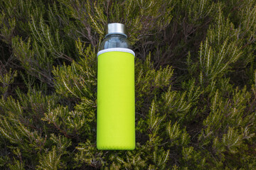 bottle of water on green grass