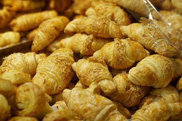 Sale of Cheese croissants and other pastries on the counter in the Supermarket in Surabaya, Indonesia.