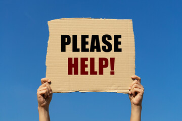Please help text on box paper held by 2 hands with isolated blue sky background. This message board...