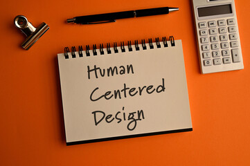 There is a notebook with the word Human Centered Design. It is eye-catching image.