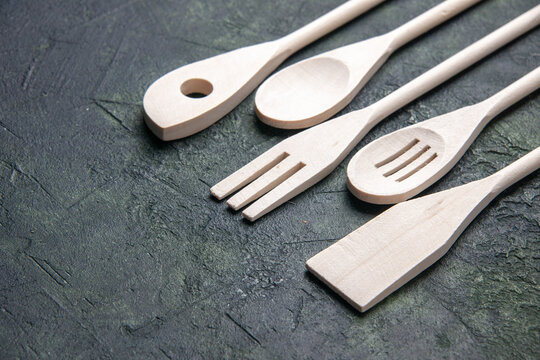 front view plastic utencils on dark background knife photo fork kitchen food plastic cutlery dinner spoon