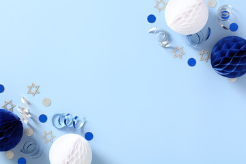 Jewish holidays decorations with confetti on blue table. Greeting card template for Israel...