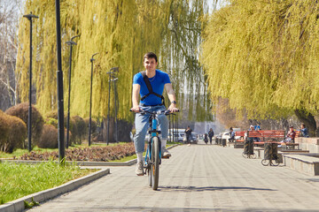 Urban biking teenage boy racing bike in city