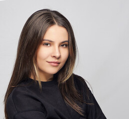 Portrait of a charismatic young brunette girl close-up.