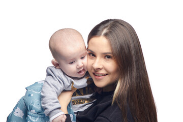 Young girl with a baby in her arms, joy with a newborn laughing