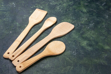 front view wooden utencils on dark background knife kitchen cutlery dinner wood color food