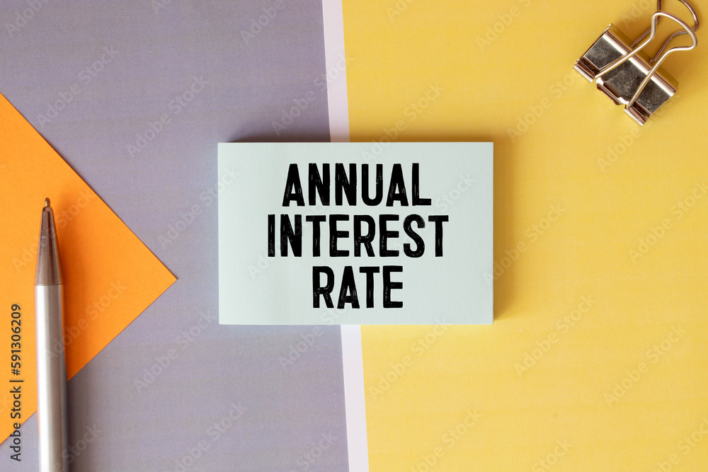 Poster concept of nominal interest rate write on sticky notes isolated on wooden table.