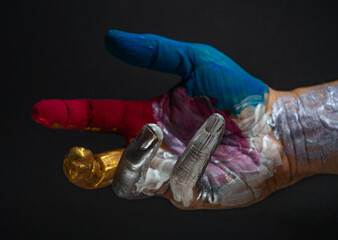Beautiful composition of a colorfully painted hand