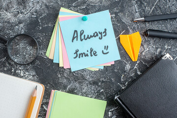 top view always smile note with pens on gray background student paper college lesson school study...