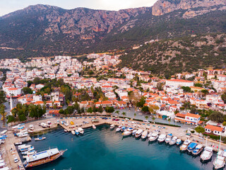 Naklejka premium View from drone of small Turkish town of Kas on Turquoise Coast of Aegean Sea overlooking embankment and marina