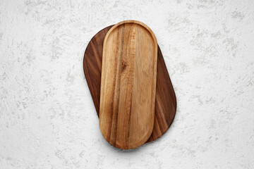 Wooden kitchen boards on light background