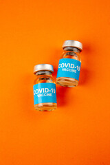top view antivirus vaccines in little cans on orange background lab disease color virus covid- health pandemic science