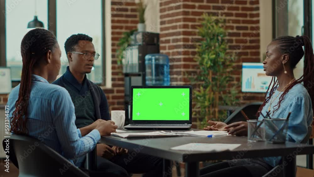 Aufkleber workers using laptop with green screen in coworking space, meeting to discuss new business vision in