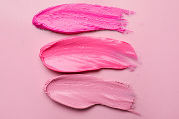 Lipstick strokes on pink background