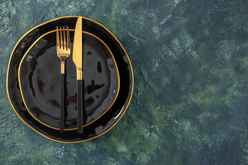 top view black plates different sized with knife and fork on dark background meal meat cuisine kitchen food darkness cutlery free space