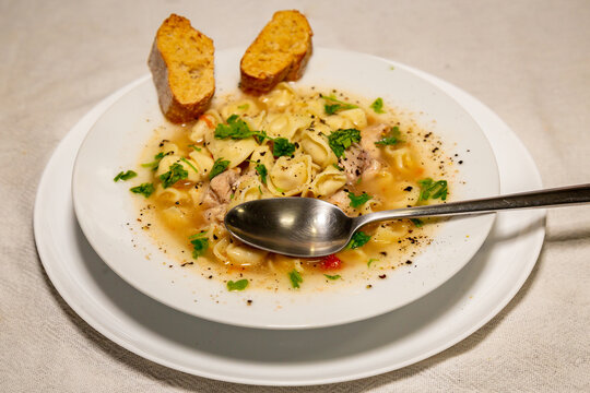 Traditional chicken agnolini (capeletti) soup. winter soup. Top view