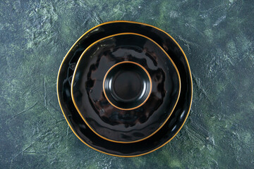 top view black round plate on dark background meal meat cuisine shine cutlery kitchen food darkness