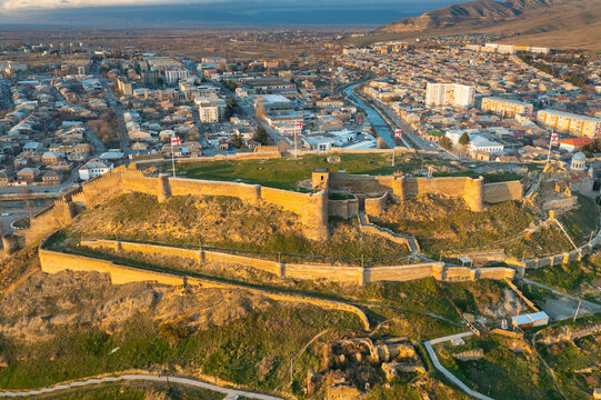 Aerial view of medieval Gori fortress and city center of Gori on sunset, Georgia