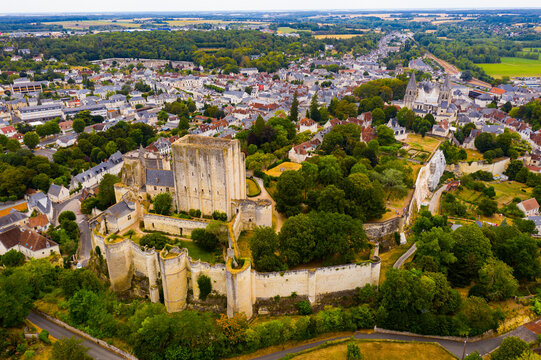 Scenic drone view of medieval fortified castle with royal residence and St Ours church in historic French town of Loches in summer..