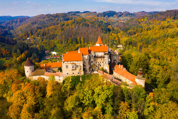 Fototapeta na wymiar Medieval castle of Pernstein on a hill in the forest. South Moravian region. Czech Republic
