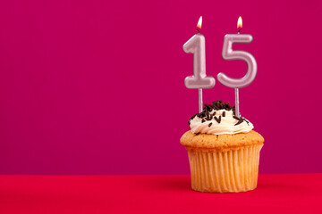 Candle number 15 - Cake birthday in rhodamine red background