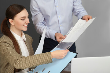 Businesspeople working together with documents in office