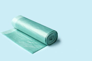 Roll of garbage bags on blue background