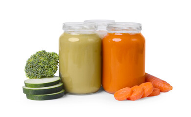 Jars of healthy baby food and fresh vegetables on white background