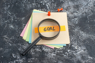 top view goal written note on sticker on a gray background college lesson notepad note school paper...