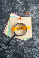 top view goal written note on sticker on gray background college lesson notepad note school paper...