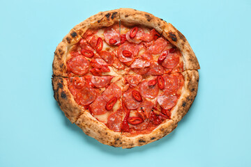 Delicious pepperoni pizza on blue background