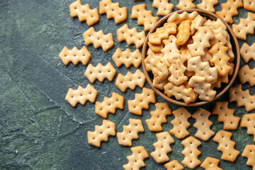top view little crackers inside plate on dark background crisp color snack cips salt bread dry food pepper