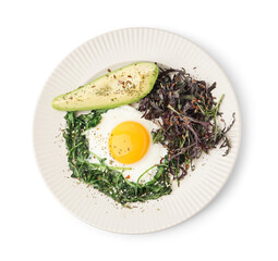 Plate with tasty fried egg, avocado and greens on white background