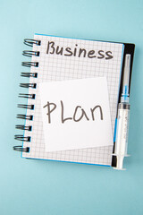 top view open copybook with plan note and injection on blue background color school college virus covid-