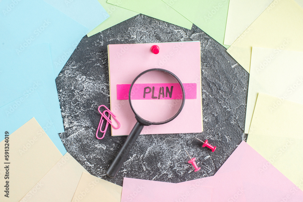 Wall mural top view plan written note with magnifier on gray background student paper college lesson notepad pe
