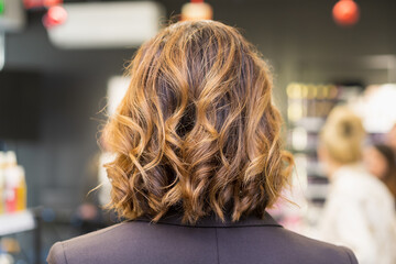 Fototapeta premium The process of creating hairstyles, hair care. Background, selective focus.