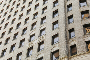 city brick buildings can symbolize urbanization, industrialization, and modernity, representing stability and endurance, while the cityscape suggests a bustling and dynamic environment