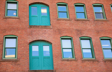 city brick buildings can symbolize urbanization, industrialization, and modernity, representing stability and endurance, while the cityscape suggests a bustling and dynamic environment