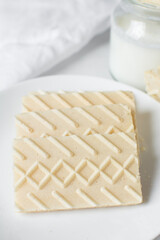 Vanilla wafers on a marble plate, wafer cookies filled with vanilla cream