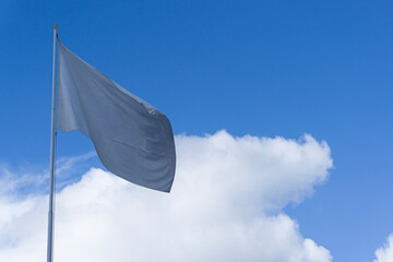 white flag with clouds