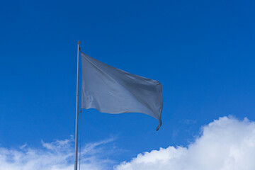 white flag with clouds