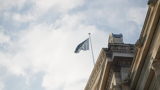Broken EU flag on top of governmental building