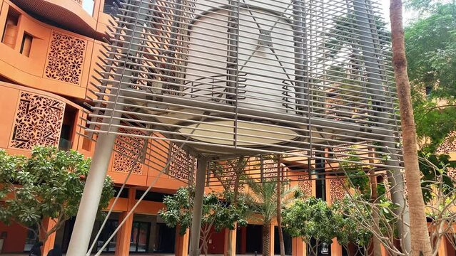 UAE, Abu Dhabi - 13th march, 2023: Wind Tower and surrounding buildings in Masdar City