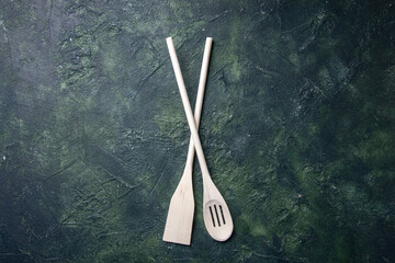 top view white plastic utencils on dark background plastic fork wood knife kitchen food photo...