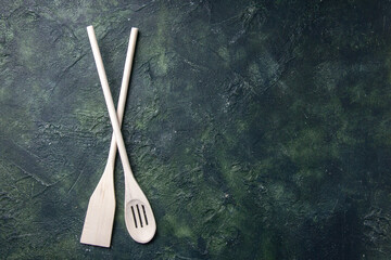 top view white plastic utencils on dark background plastic fork wood knife kitchen food photo cutlery free space