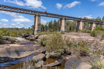 Heritage-listed Quart Pot Creek Rail Bridge (or Red Bridge) - constructed in 1886 as part of the Brisbane-Sydney interstate rail link - Stanthorpe, QLD, Australia - obrazy, fototapety, plakaty