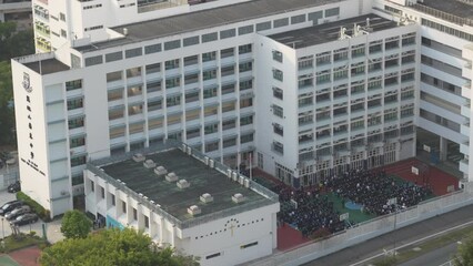 Students Forming in Hong Kong School Courtyard. Wide Angle Shot of Hong Kong School