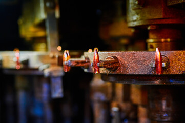 Round clamp with shiny bullet at ammo factory shop closeup