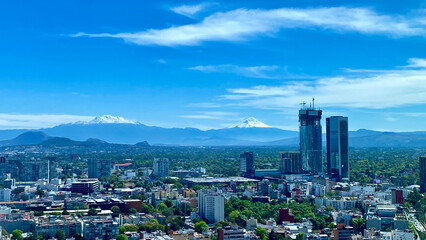 Obraz premium High Angle View Of City Buildings Against Cloudy Sky at mexico city